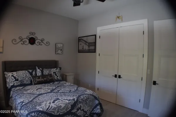 a bedroom with a bed and a walk in closet