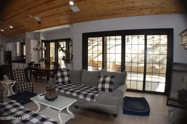 a kitchen with stainless steel appliances granite countertop a sink and a refrigerator
