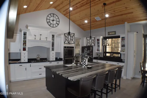 a kitchen with sink refrigerator and window
