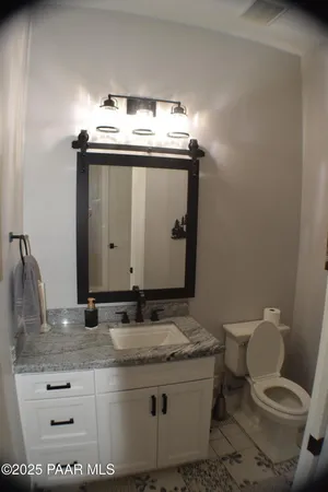 a view of hallway with livingroom and stairs