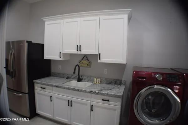 a bed room with a bed and a television