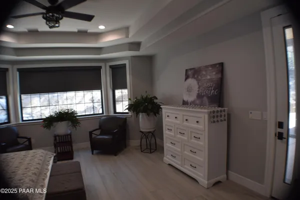 a bedroom with a bed and a dresser in it