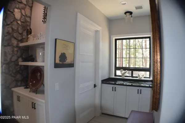 a kitchen with granite countertop stainless steel appliances a stove a sink and a granite counter tops