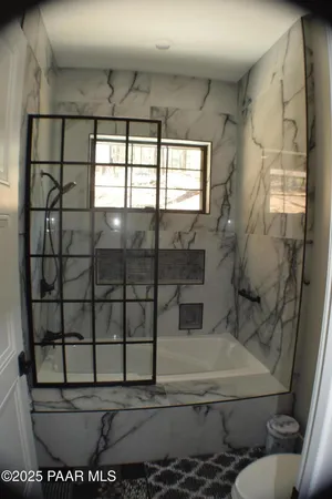 a bedroom with a bed and wall painting