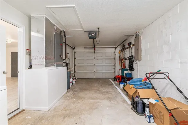 a view of a room with window and a ceiling fan