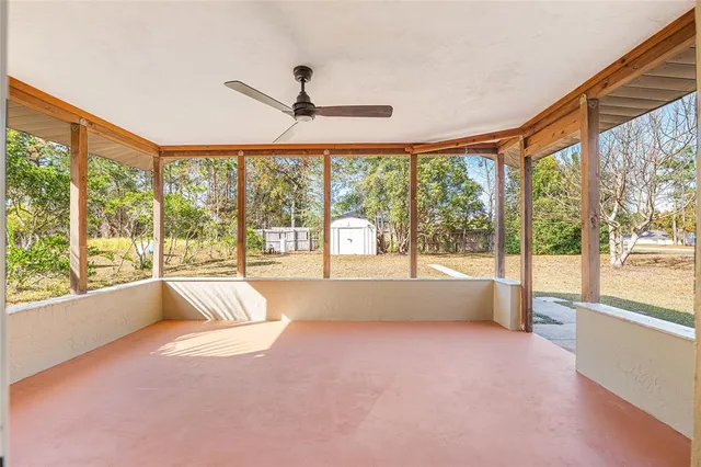 a view of an empty room with a large window