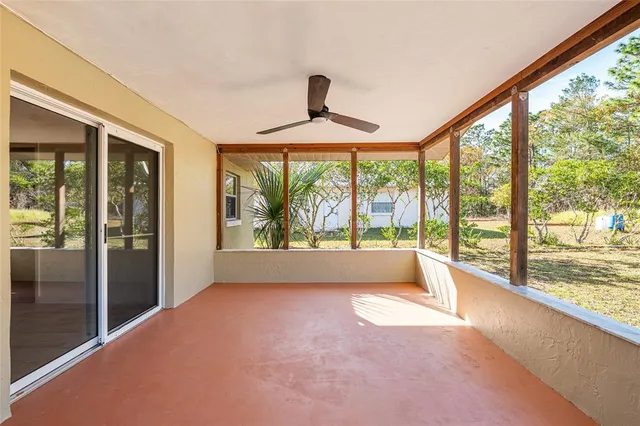 a view of a house with backyard and garden