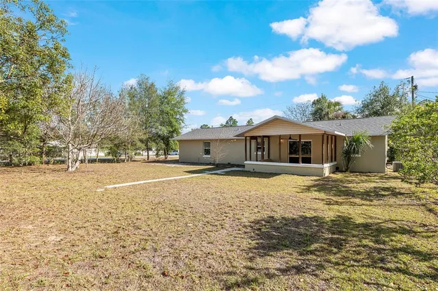 a view of open space with yard