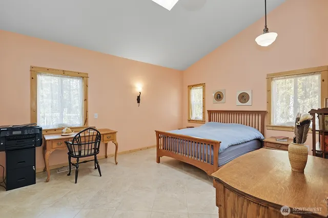 a bedroom with furniture and a window