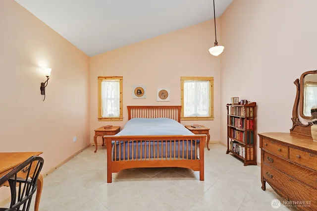 a bedroom with a bed and furniture