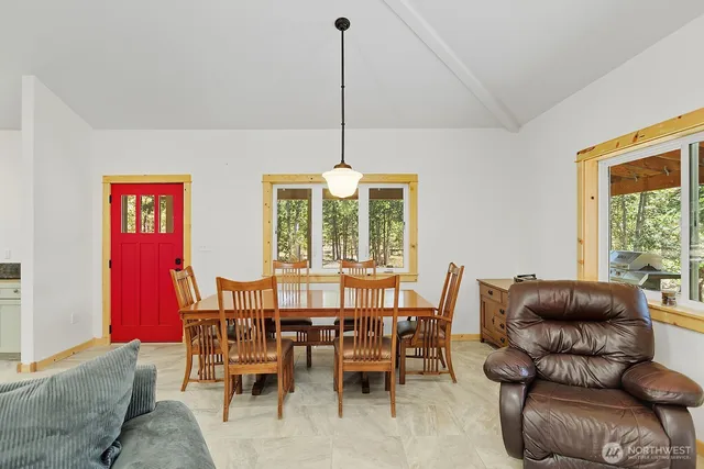 a dining room with furniture and window