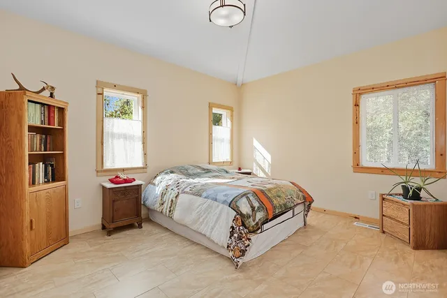 a bedroom with a bed and window