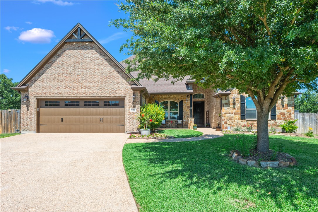 3301 Covington Court Bryan, TX 77808 - Photo 1 of 26 a front view of a house with a yard and garage