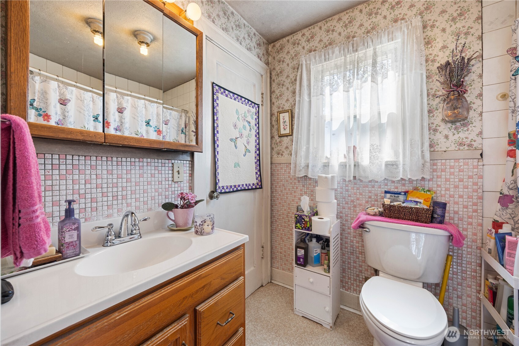 1281 Totem Pole Road Manson, WA 98831 - Photo 13 of 39 a bathroom with a sink a toilet a mirror and shower curtain