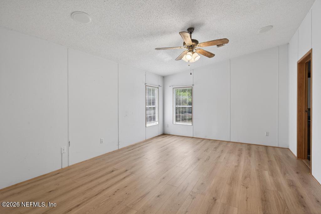 54059 Charles Street Callahan, FL 32011 - Photo 27 of 50 wooden floor in an empty room with a window