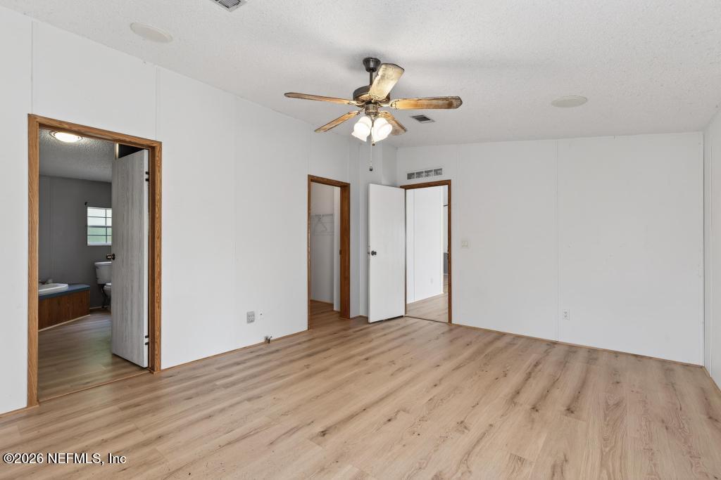 54059 Charles Street Callahan, FL 32011 - Photo 28 of 50 wooden floor in an empty room with a window