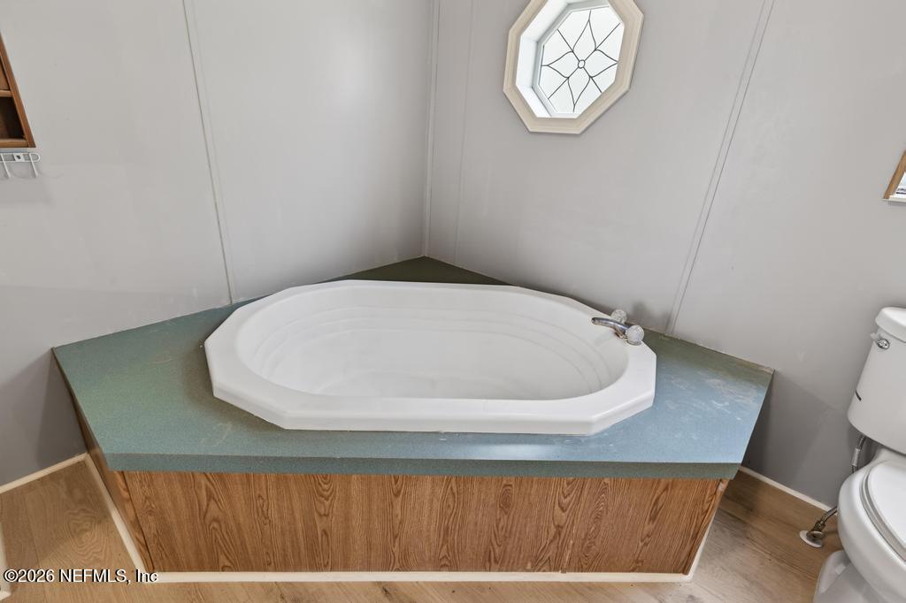 54059 Charles Street Callahan, FL 32011 - Photo 32 of 50 a bathroom with a toilet and a sink