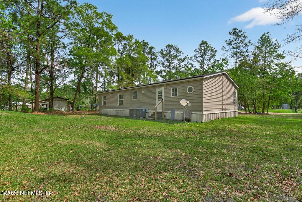 54059 Charles Street Callahan, FL 32011 - Photo 39 of 50 a house view with a garden space