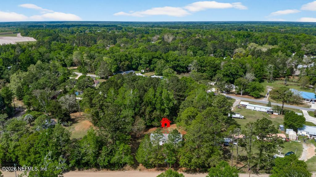 54059 Charles Street Callahan, FL 32011 - Photo 40 of 50 an aerial view of residential houses with outdoor space and trees