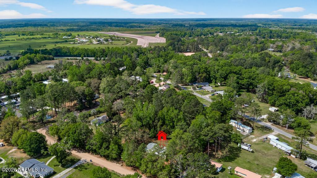 54059 Charles Street Callahan, FL 32011 - Photo 41 of 50 a view of a yard with an outdoor seating