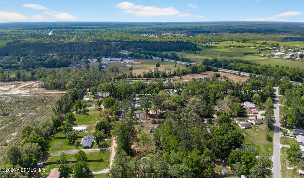 54059 Charles Street Callahan, FL 32011 - Photo 42 of 50 a view of a city with lots of residential buildings ocean and mountain view in back