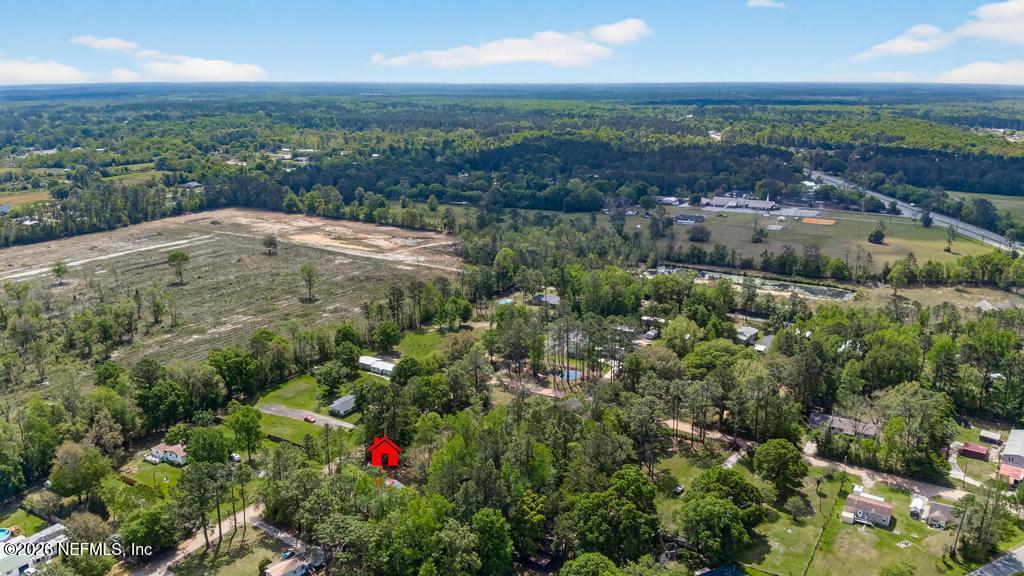 54059 Charles Street Callahan, FL 32011 - Photo 44 of 50 an aerial view of residential houses with outdoor space and trees