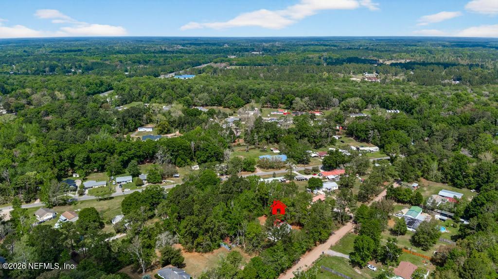54059 Charles Street Callahan, FL 32011 - Photo 48 of 50 an aerial view of residential houses with outdoor space and trees