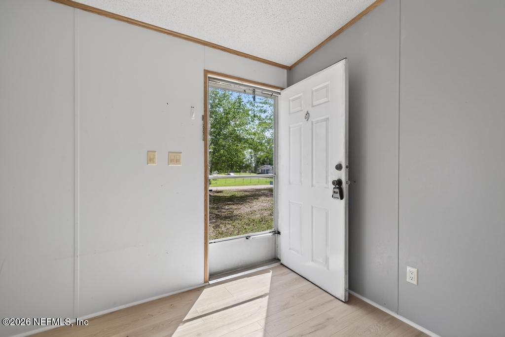 54059 Charles Street Callahan, FL 32011 - Photo 5 of 50 a view of an entryway with wooden floor