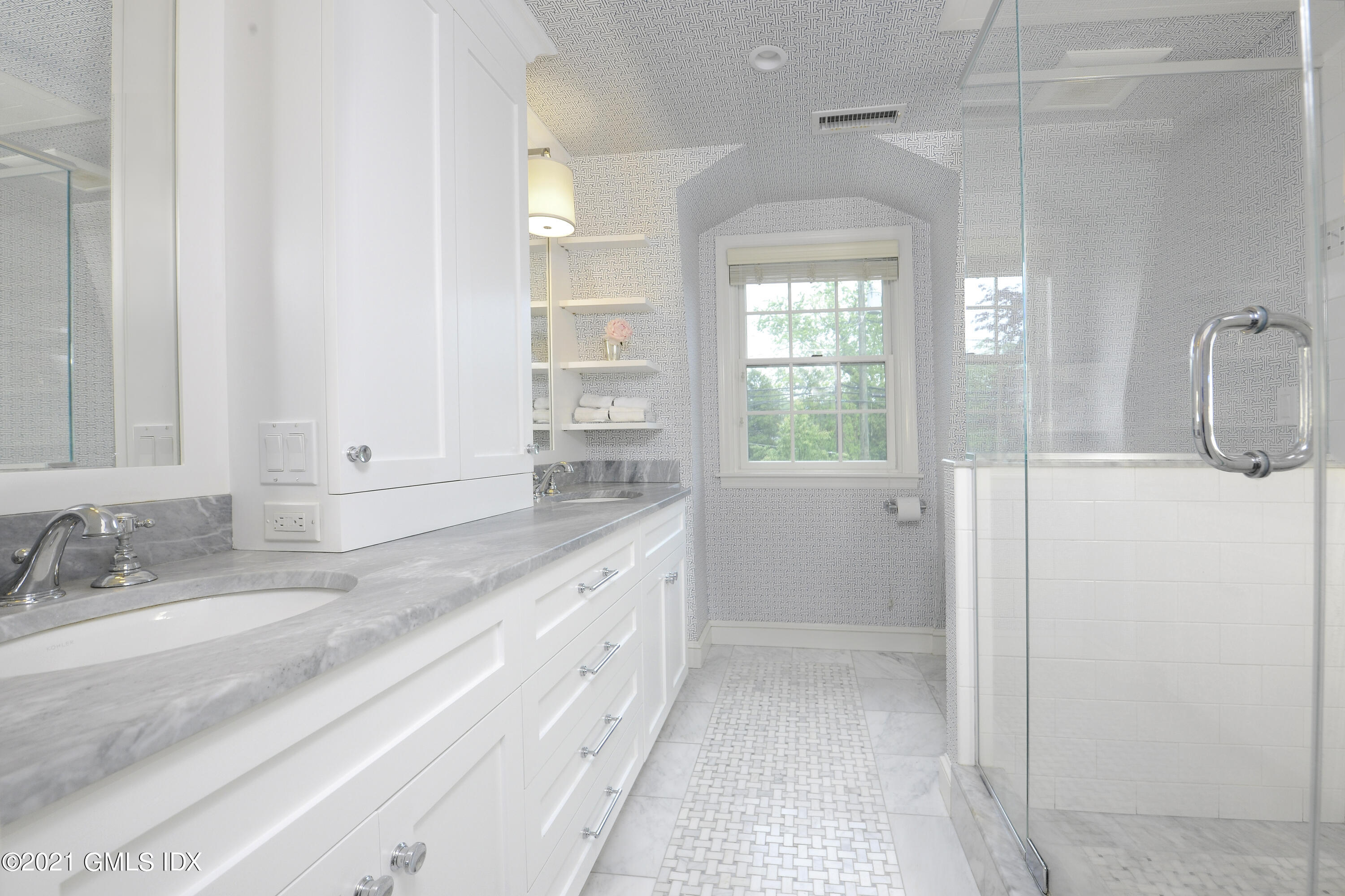145 Shore Road Old Greenwich, CT 06870 - Photo 15 of 25 a bathroom with a sink and a mirror