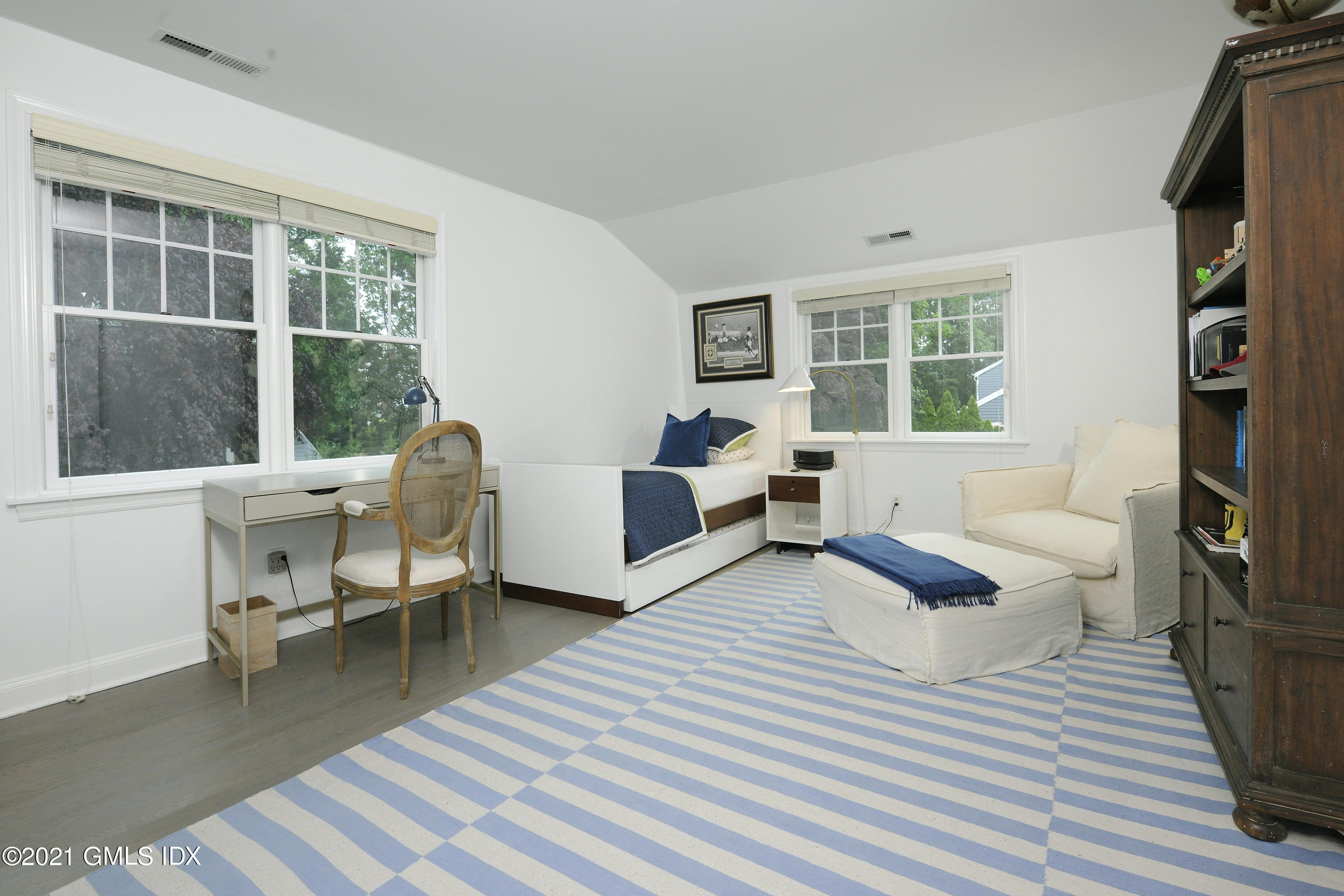 145 Shore Road Old Greenwich, CT 06870 - Photo 17 of 25 a living room with furniture and a window