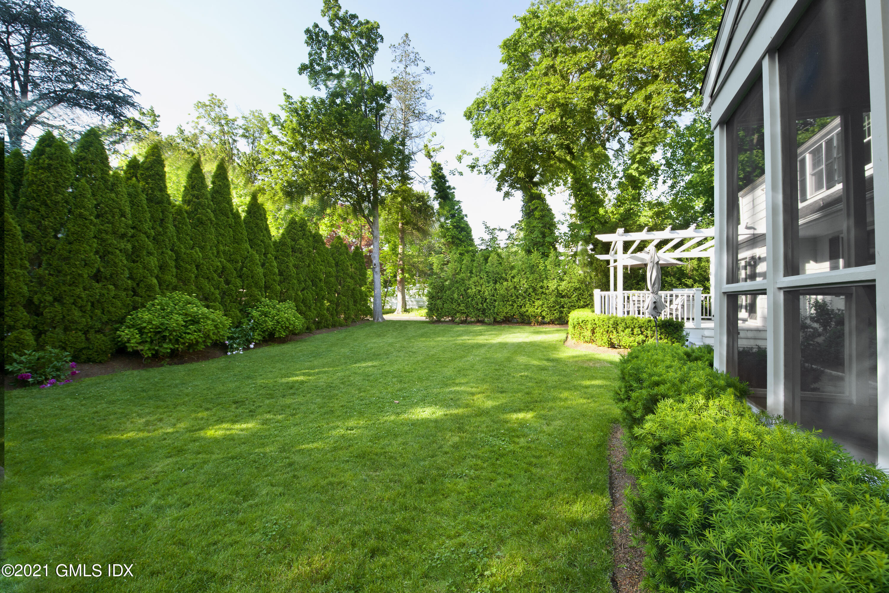 145 Shore Road Old Greenwich, CT 06870 - Photo 21 of 25 a view of yard with green space