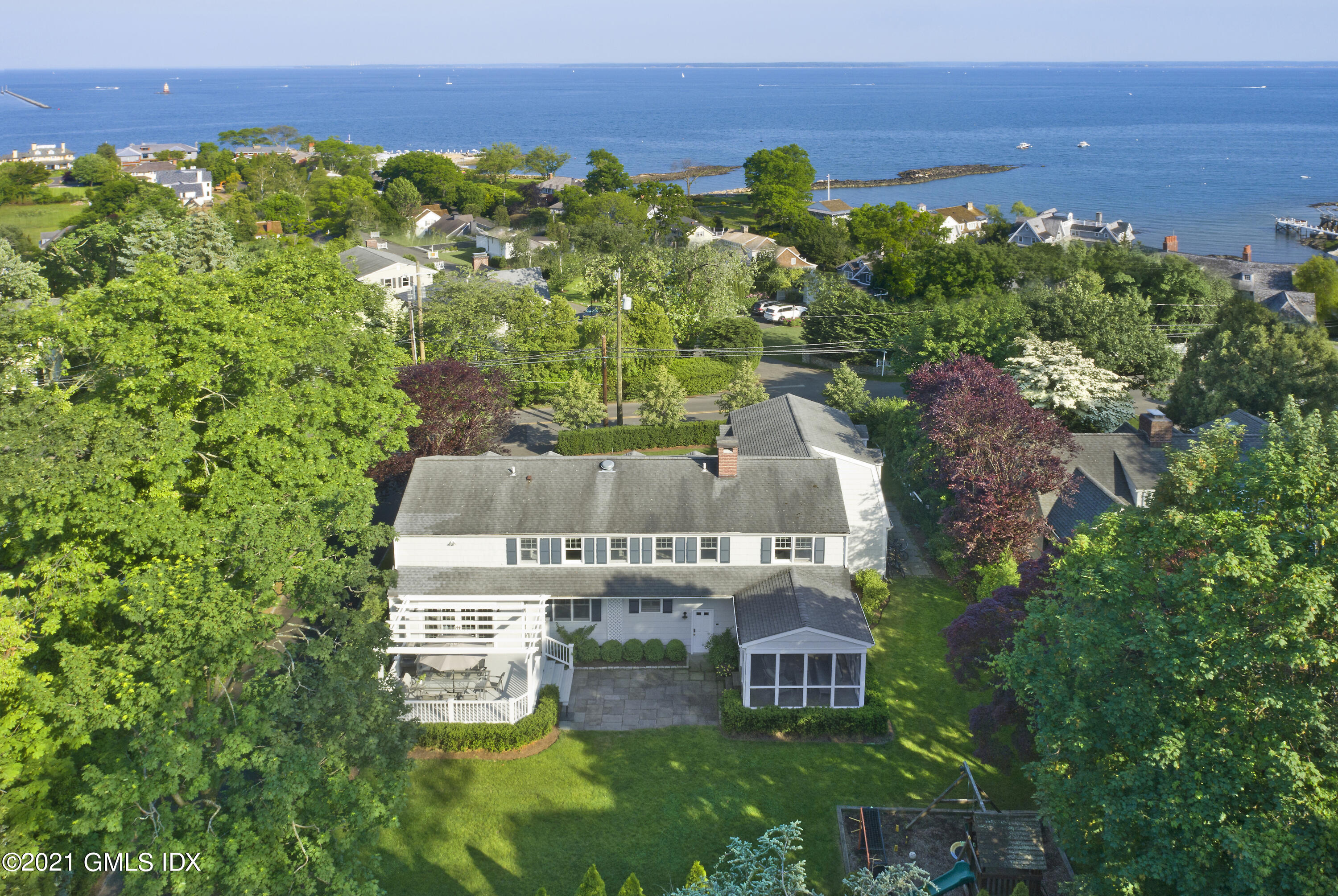 145 Shore Road Old Greenwich, CT 06870 - Photo 25 of 25 an aerial view of a house with a garden
