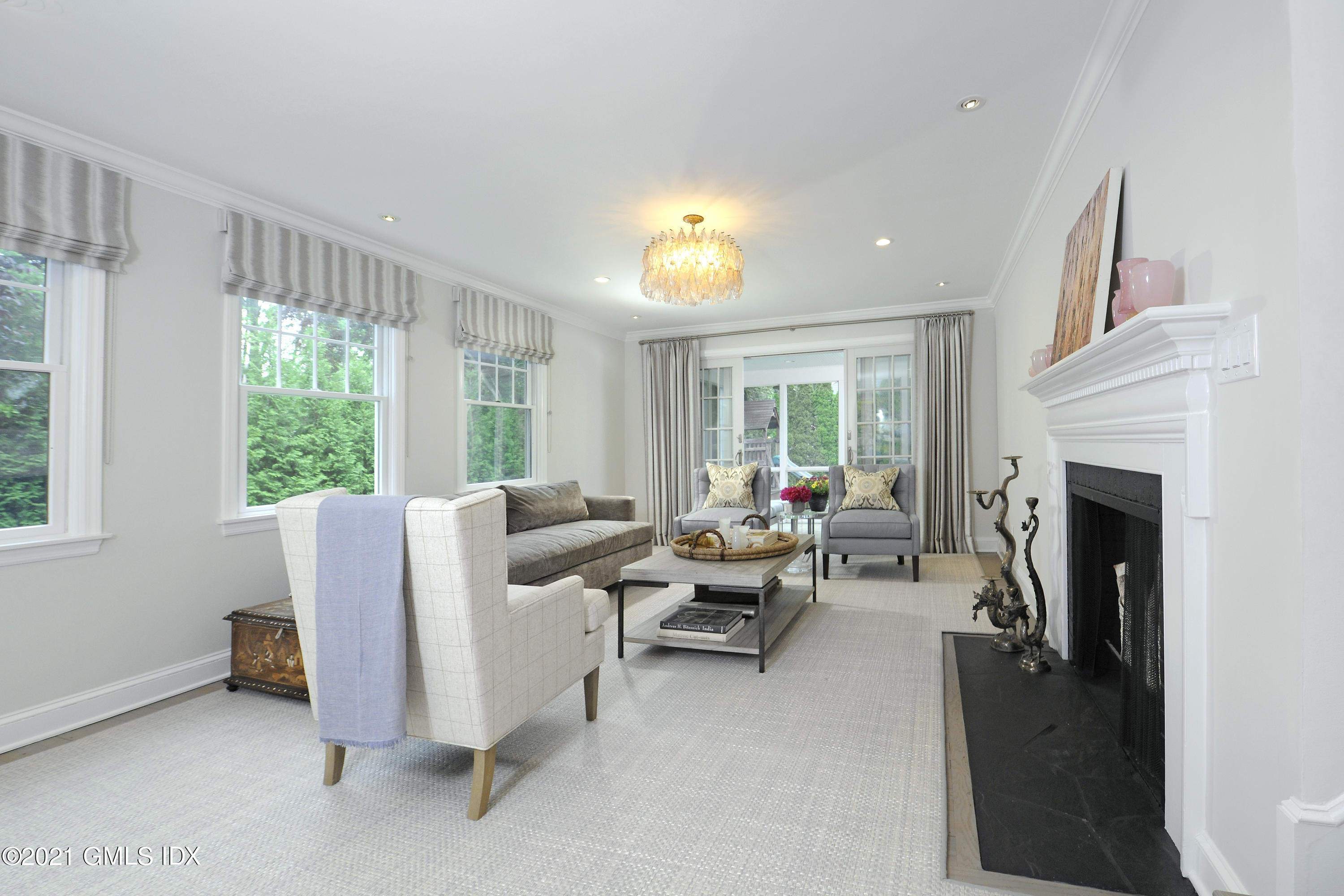 145 Shore Road Old Greenwich, CT 06870 - Photo 3 of 25 a living room with furniture and a fireplace