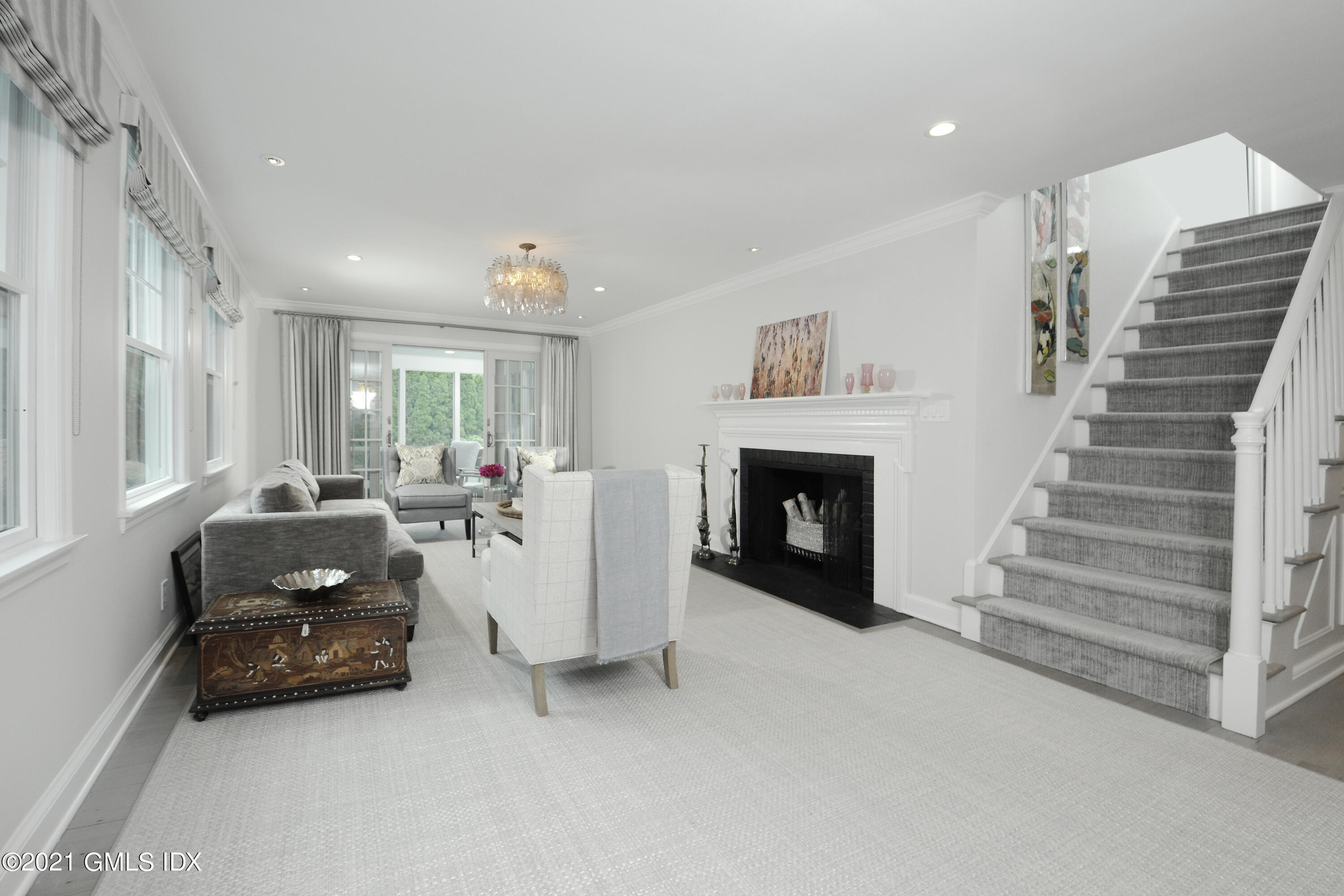 145 Shore Road Old Greenwich, CT 06870 - Photo 5 of 25 a living room with furniture and a fireplace