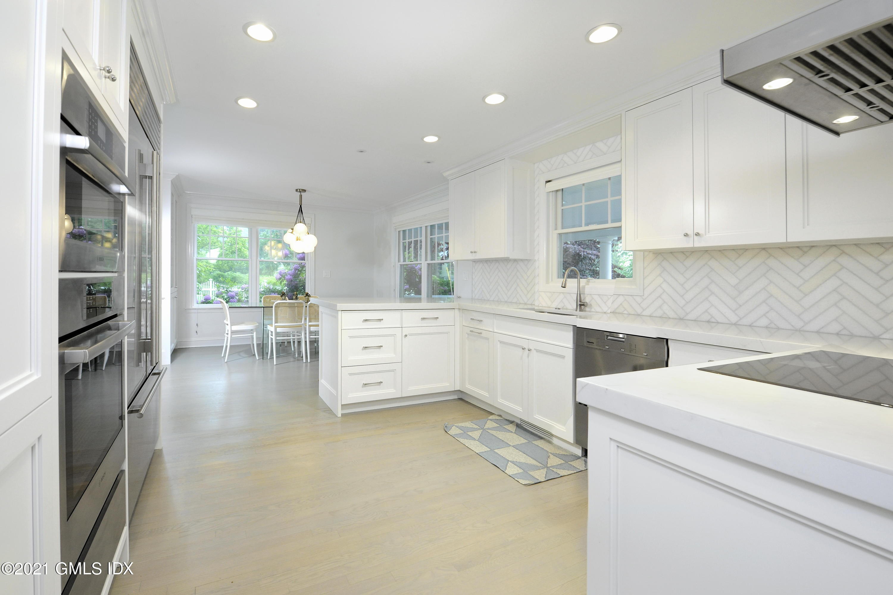 145 Shore Road Old Greenwich, CT 06870 - Photo 8 of 25 a kitchen with a sink cabinets and counter top space