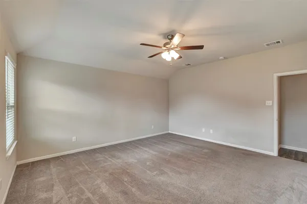 an aerial view of residential houses with outdoor space and parking