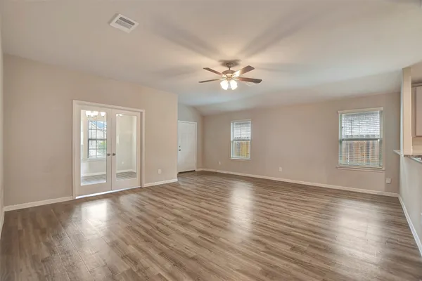 a kitchen with stainless steel appliances granite countertop a refrigerator a stove and a sink