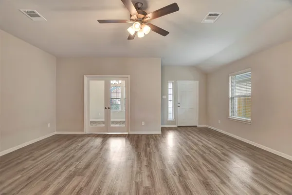 a kitchen with stainless steel appliances granite countertop wooden cabinets and sink