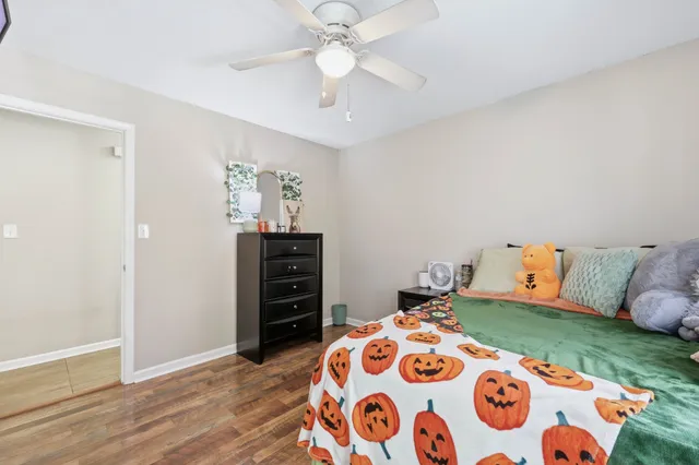 a bedroom with a bed and a dresser