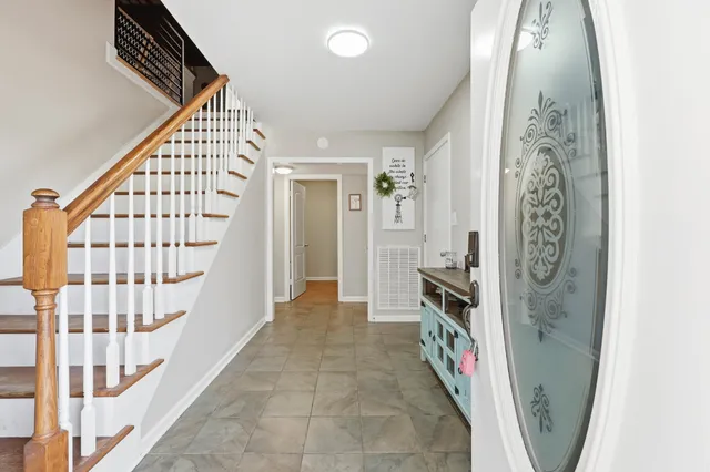 a view of an entryway with wooden floor