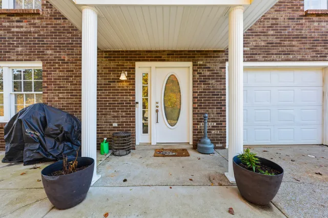a front view of a house with outdoor seating
