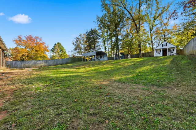 a view of a house with a big yard