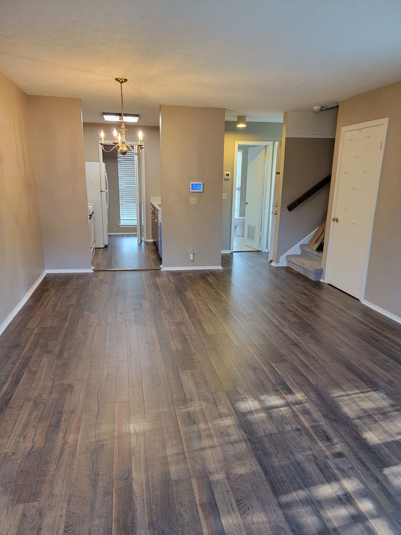 809 Rachels View Hermitage, TN 37076 - Photo 10 of 18 an empty room with wooden floor and chandelier