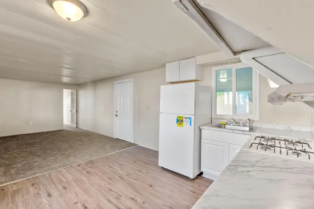 a view of a kitchen with a sink