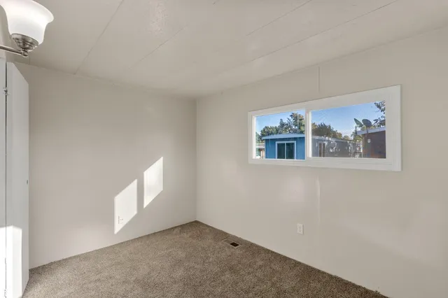a view of empty room with windows