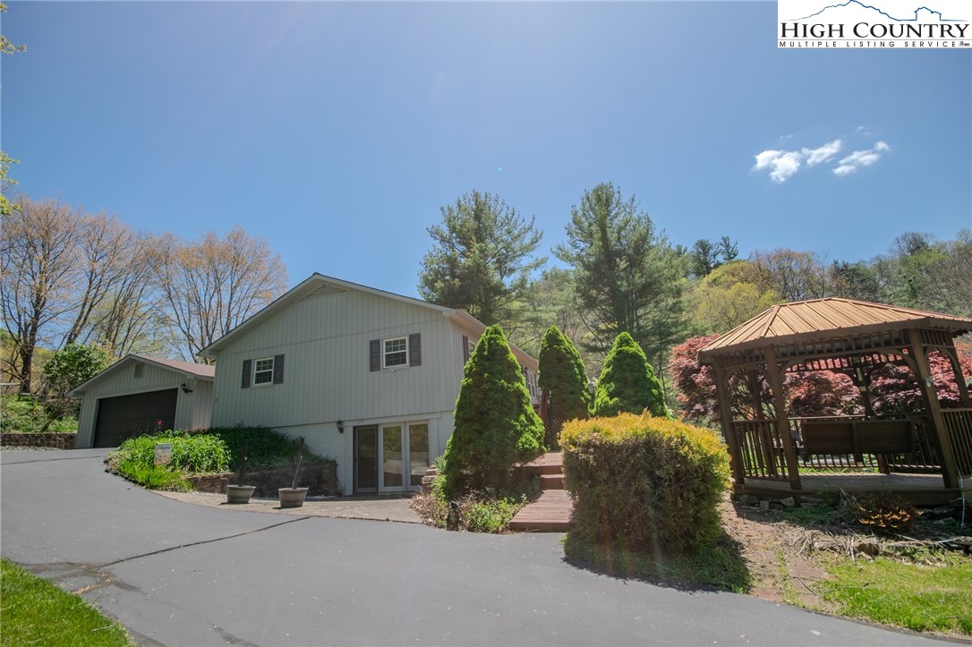 1268 Pine Run Road Boone, NC 28607 - Photo 2 of 48 a front view of a house with a yard