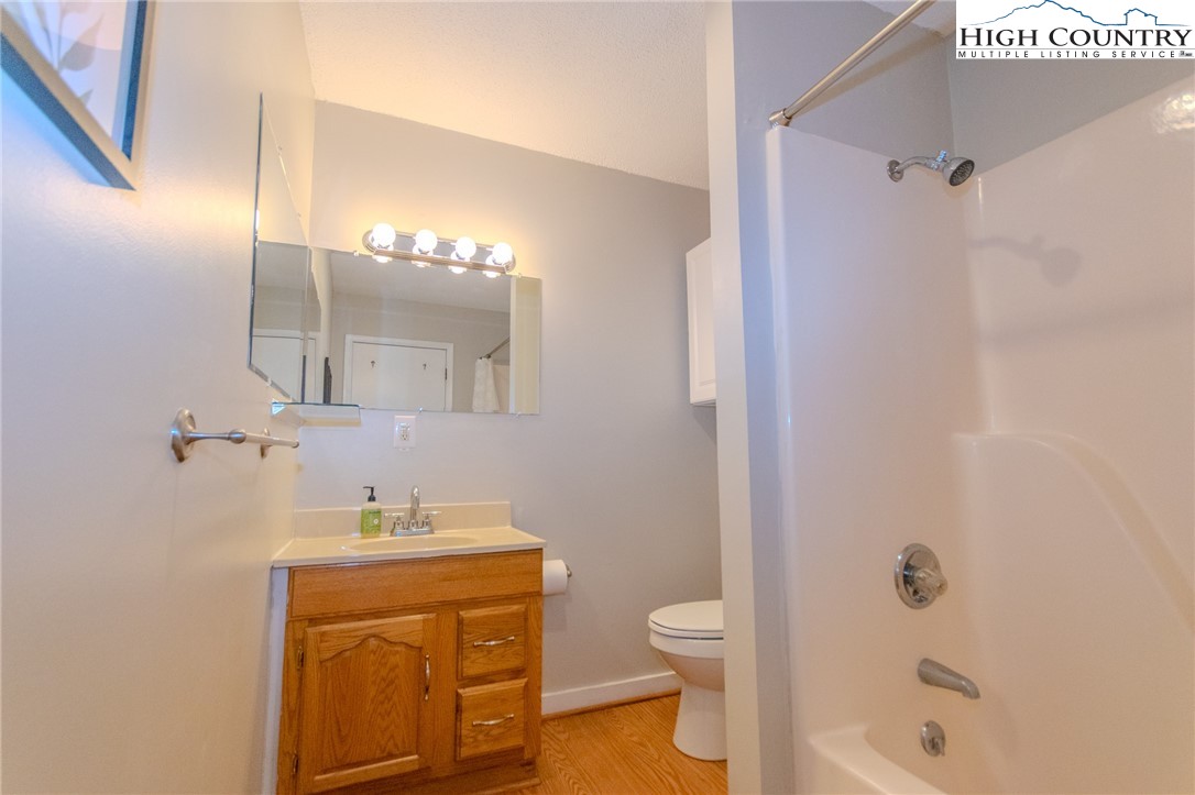 1268 Pine Run Road Boone, NC 28607 - Photo 21 of 48 a bathroom with a sink a toilet and shower