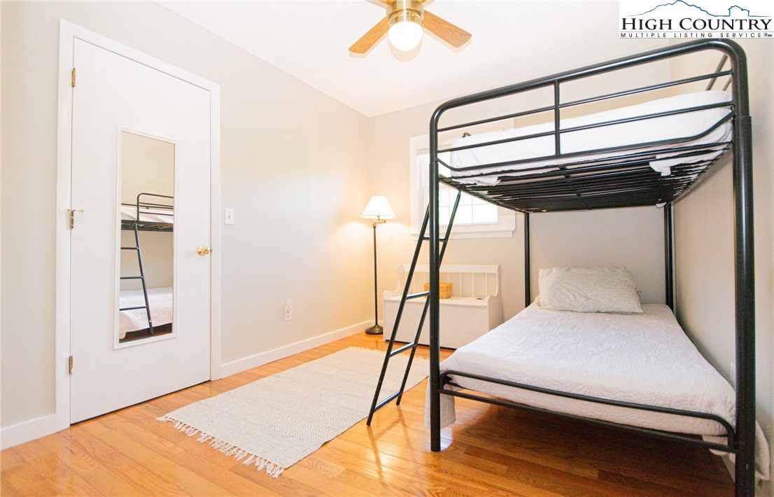 1268 Pine Run Road Boone, NC 28607 - Photo 24 of 48 a living room with a bed furniture and a window