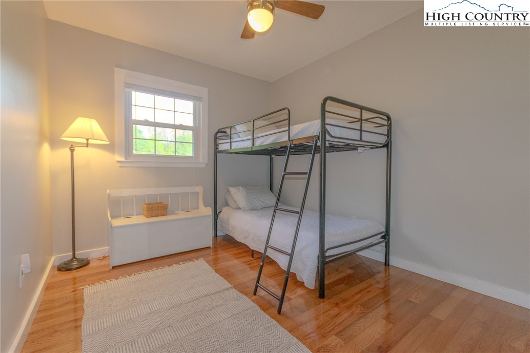 1268 Pine Run Road Boone, NC 28607 - Photo 25 of 48 a view of an empty room with window and wooden floor