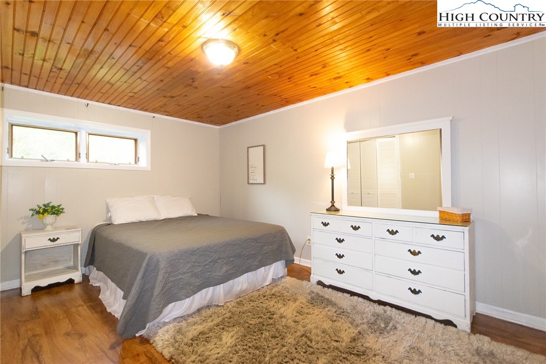 1268 Pine Run Road Boone, NC 28607 - Photo 27 of 48 a bedroom with a bed and a window